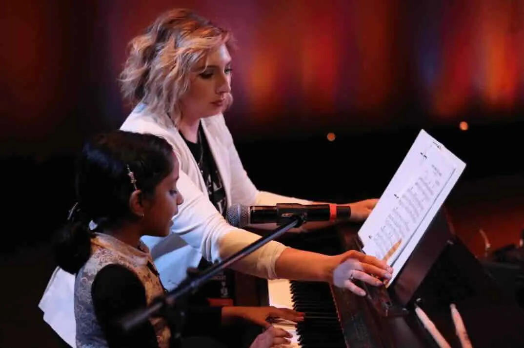 Piano lessons near me — student at the piano at Real Brave music school NJ
